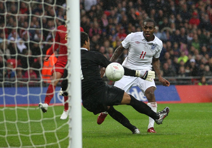 Danny Rose steers the ball beyond Portugal goalkeeper, Hugo Ventura, to score England's winning goal at Wembley Stadium
